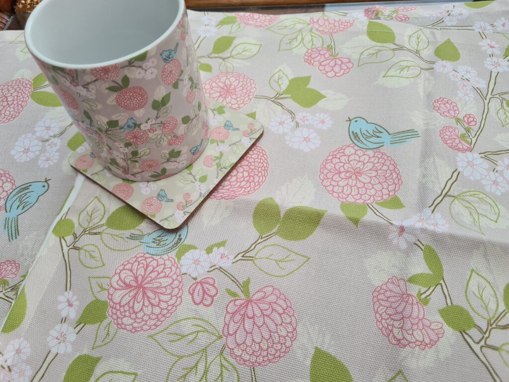 birds and pink flower pattern on a cotton tea towel